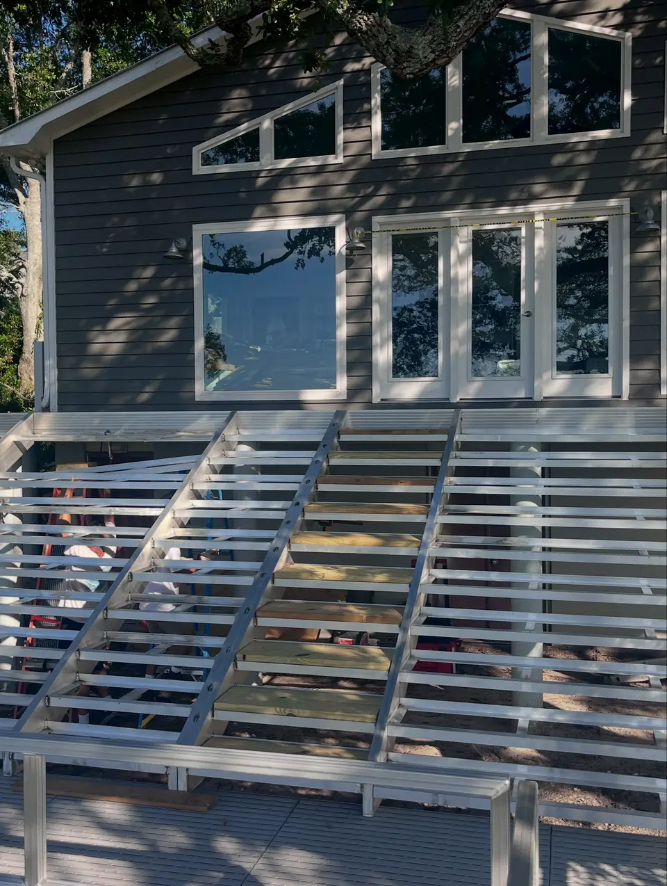 Aluminum stair and deck framing replacing an old wooden deck