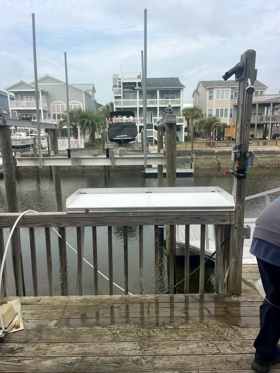 Aluminum fish cleaning station mounted on a dock railing
