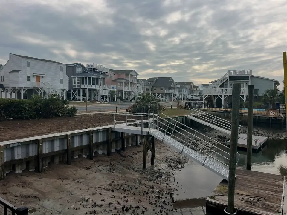Finished seawall with aluminum gangway leading to the water